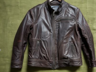 Worn and damaged leather jacket in need of restoration